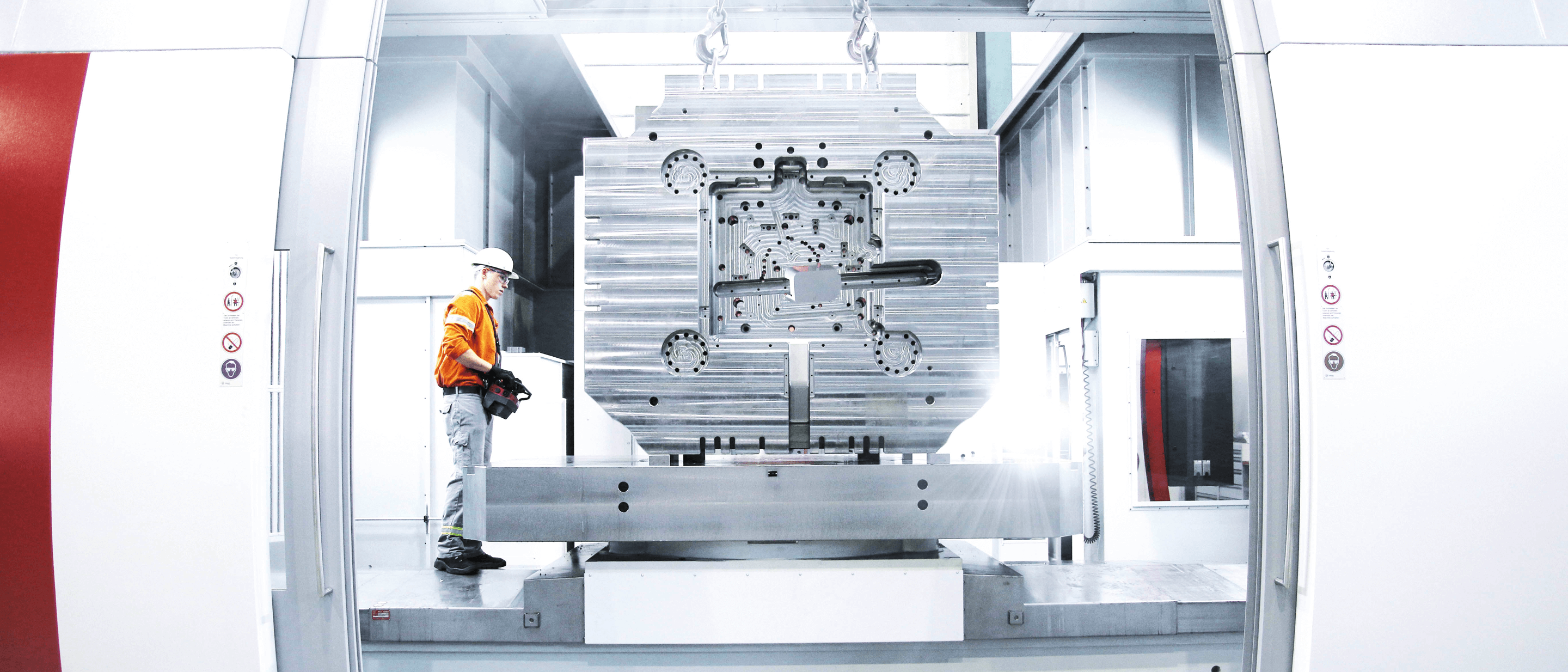 man in protective gear working in steel production