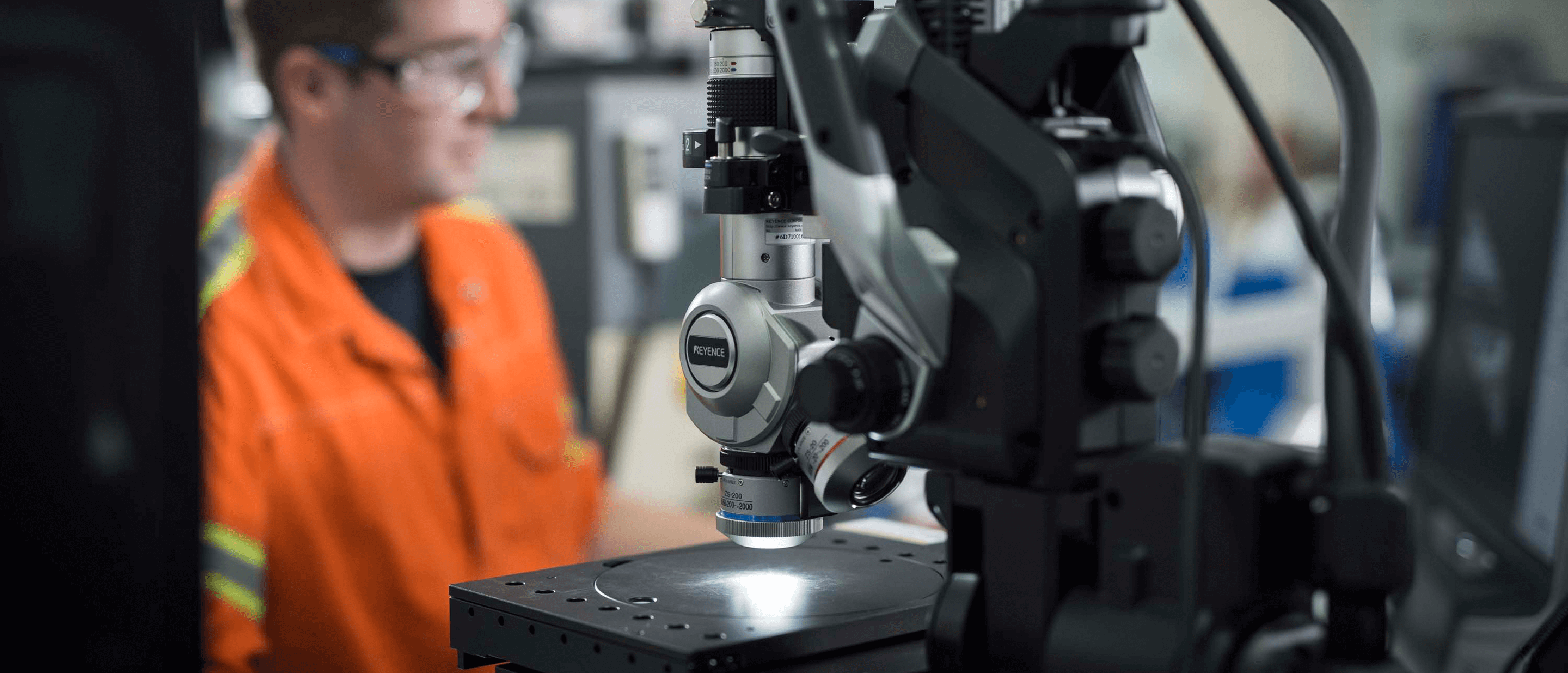 a worker wearing safety gear is seen working in a testing laboratory